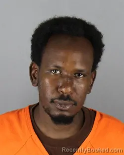Mugshot of Mustaf Abdi Adan booked in Hennepin County, Minnesota on August 24, 2026