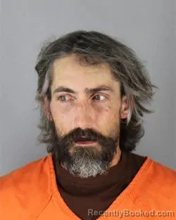 Mugshot of Joshua Blu Olson booked in Hennepin County, Minnesota on August 24, 2026