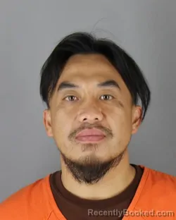 Mugshot of Kou Lee booked in Hennepin County, Minnesota on August 25, 2026