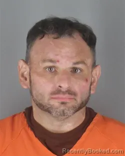 Mugshot of Joshua Allan Rogerson booked in Hennepin County, Minnesota on August 25, 2026