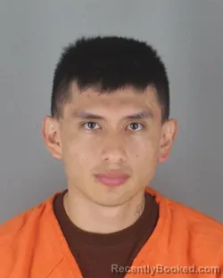 Mugshot of John Alex Rodriguez Pungana booked in Hennepin County, Minnesota on August 26, 2026