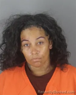 Mugshot of Carmen Muneca Reyes booked in Hennepin County, Minnesota on August 27, 2026