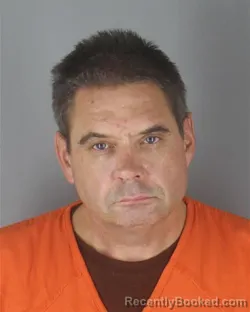Mugshot of Christopher Knute Olson booked in Hennepin County, Minnesota on August 28, 2026