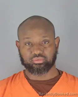 Mugshot of Nasser Ahmed Aibo booked in Hennepin County, Minnesota on August 29, 2026