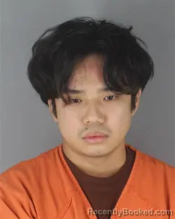 Mugshot of Tri Quang Cao Nguyen booked in Hennepin County, Minnesota on August 29, 2026