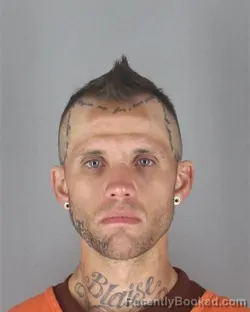 Mugshot of Spencer Alexander Beseman booked in Hennepin County, Minnesota on August 29, 2026