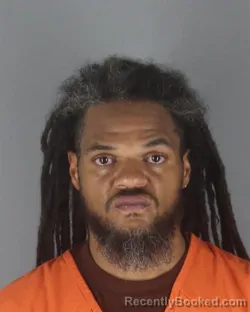 Mugshot of Raymond Charles Harris booked in Hennepin County, Minnesota on August 29, 2026