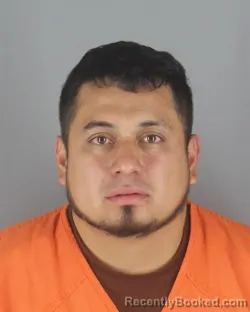 Mugshot of Alexander Javier Reinoso Chariguaman booked in Hennepin County, Minnesota on August 31, 2026