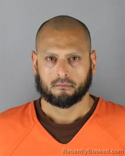 Mugshot of Rodrigo Raul Deluna booked in Hennepin County, Minnesota on September 29, 2026