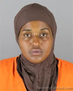 Mugshot of Muna Mohamed Absiya booked in Hennepin County, Minnesota on September 30, 2026