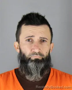 Mugshot of Jason Michael Brenna booked in Hennepin County, Minnesota on October 1, 2026