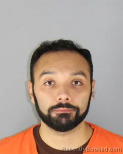 Mugshot of Loui Mubarak Zarroug booked in Hennepin County, Minnesota on October 2, 2026