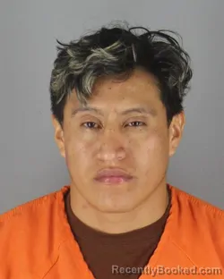 Mugshot of Juan Geovanni Auquilla Bonilla booked in Hennepin County, Minnesota on October 4, 2026