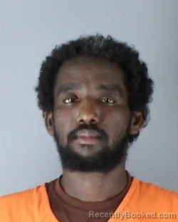 Mugshot of Mohamed Hassan Aden booked in Hennepin County, Minnesota on October 4, 2026