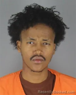 Mugshot of Guled Mohamed Ogle booked in Hennepin County, Minnesota on October 7, 2026