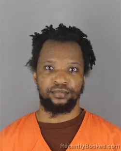 Mugshot of Adogbeji George Okan booked in Hennepin County, Minnesota on October 7, 2026