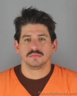 Mugshot of Armando Miguel Gutierrez booked in Hennepin County, Minnesota on October 7, 2026