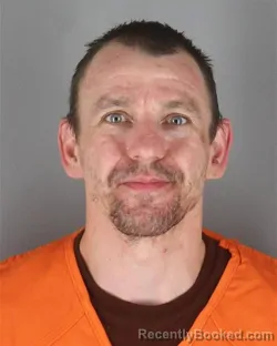 Mugshot of Joshua Adam Mrsich booked in Hennepin County, Minnesota on October 8, 2026