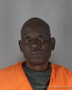 Mugshot of Olubunmi Emmanuel Okunnaiya booked in Hennepin County, Minnesota on October 12, 2026