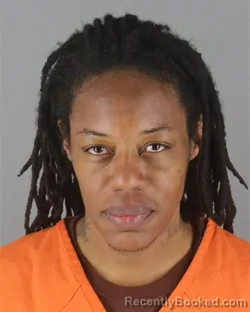 Mugshot of Essence Shanice Burns booked in Hennepin County, Minnesota on October 13, 2026