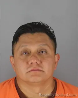 Mugshot of Marcelo Claderto Estrella-Ortiz booked in Hennepin County, Minnesota on October 14, 2026