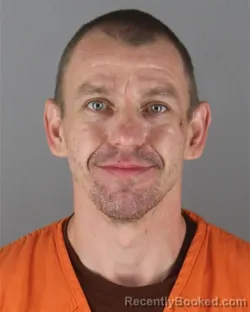 Mugshot of Joshua Adam Mrsich booked in Hennepin County, Minnesota on October 14, 2026