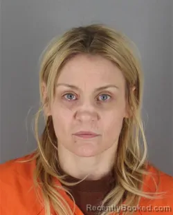 Mugshot of Nicole Marie Racciatti booked in Hennepin County, Minnesota on October 14, 2026