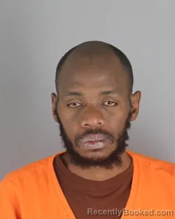 Mugshot of Daniel Monubi Okemwa booked in Hennepin County, Minnesota on October 17, 2026
