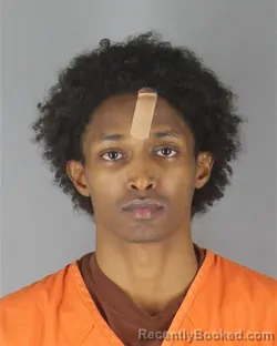 Mugshot of Khalid Mohamed Muridi booked in Hennepin County, Minnesota on October 21, 2026