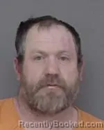 Mugshot of Christopher Andrew Koolmo booked in Isanti County, Minnesota on April 5, 2026