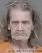 Mugshot of Gregory William Snyder booked in Isanti County, Minnesota on April 13, 2026