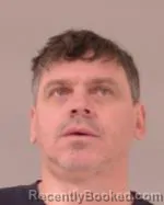 Mugshot of Yuriy Vladimiroveeh Lopin booked in Scott County, Minnesota on March 20, 2026