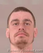 Mugshot of Adam Jeremiah Holm booked in Scott County, Minnesota on March 26, 2026