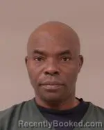 Mugshot of Charles Komla Amevo booked in Scott County, Minnesota on April 25, 2026