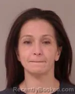 Mugshot of Nicole Marie Schlageter booked in Scott County, Minnesota on May 1, 2026