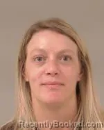 Mugshot of Lindsay Marie Lang booked in Scott County, Minnesota on May 21, 2026