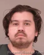 Mugshot of Carlos Alfredo Gomez booked in Scott County, Minnesota on June 2, 2026