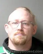 Mugshot of Justin Daniel Mickle booked in Sibley County, Minnesota on March 30, 2026