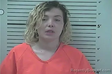 Mugshot of Jasmine Marie Delle booked in Hancock County, Mississippi on April 22, 2026