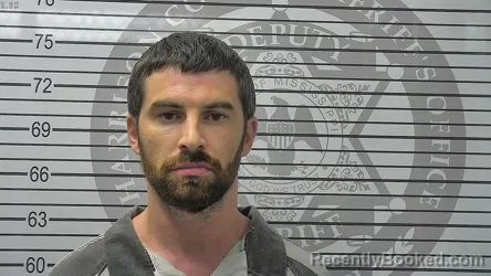 Mugshot of Brandon Christopher Travis booked in Harrison County, Mississippi on August 13, 2026