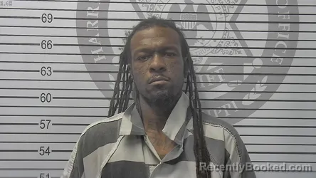 Mugshot of Devin Curt Jr Johnson booked in Harrison County, Mississippi on October 14, 2026