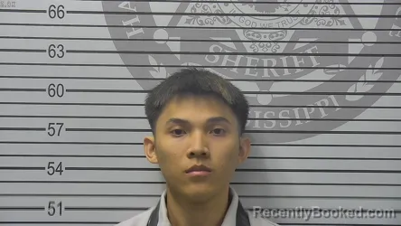 Mugshot of Thang Minh Tran booked in Harrison County, Mississippi on October 22, 2026