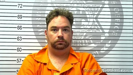 Mugshot of JUSTIN MICHAEL HOLCOMB booked in Harrison County, Mississippi on March 13, 2026
