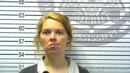 Mugshot of MEGAN MARIE GRAHAM booked in Harrison County, Mississippi on March 18, 2026