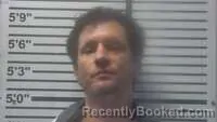 Mugshot of Jason Bustin booked in Jones County, Mississippi on August 19, 2026