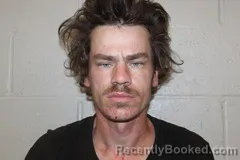 Mugshot of JUSTIN LYONS booked in Benton County, Missouri on July 14, 2026