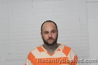 Mugshot of JUSTIN DILLON HANSON