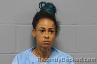 Mugshot of LUCHSAL FRALOMA MOORE booked in Johnson County, Missouri on June 4, 2026