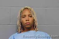 Mugshot of JAZMINE MONE'T BURNETT booked in Johnson County, Missouri on July 1, 2026