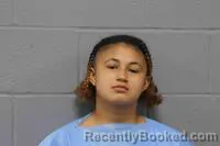 Mugshot of Anastasia Esperanza Jane Aqra booked in Johnson County, Missouri on October 24, 2026